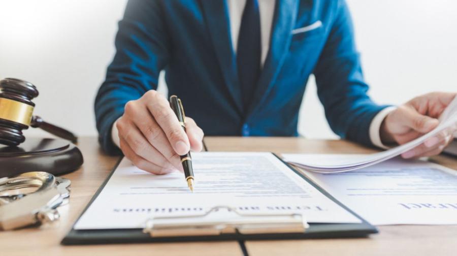 Man signing document