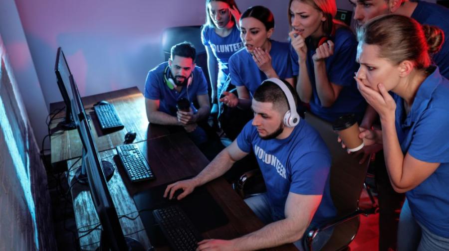 group watching computer gamer