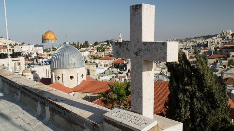 cross on a building overlooking Jerusalem