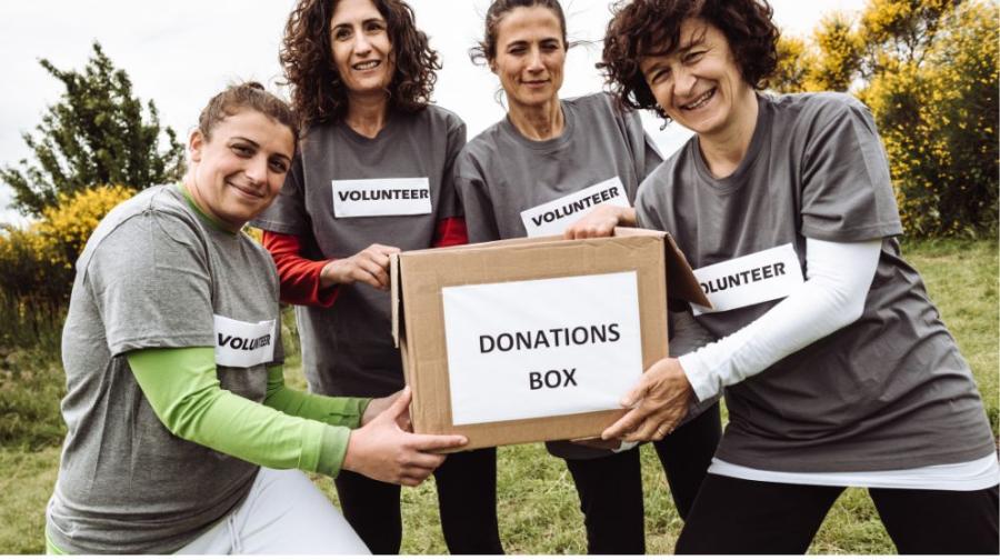 volunteers holding box