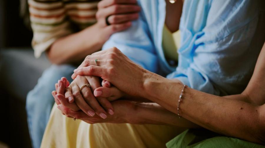 holding hands to comfort