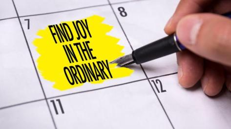 hand pointing pencil to calendar page date
