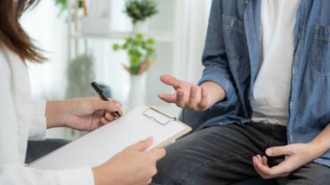 part of photo of two people meeting