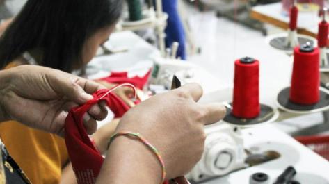 woman's hands sewing