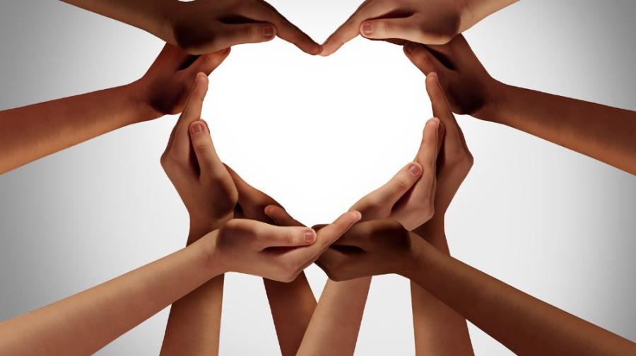 many hands forming a heart